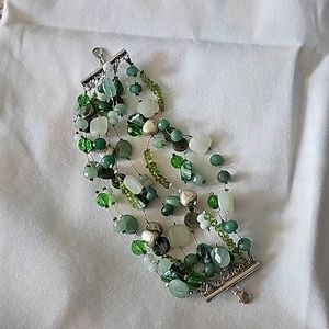 Multiple bead bracelet with silver endpiece and closure.